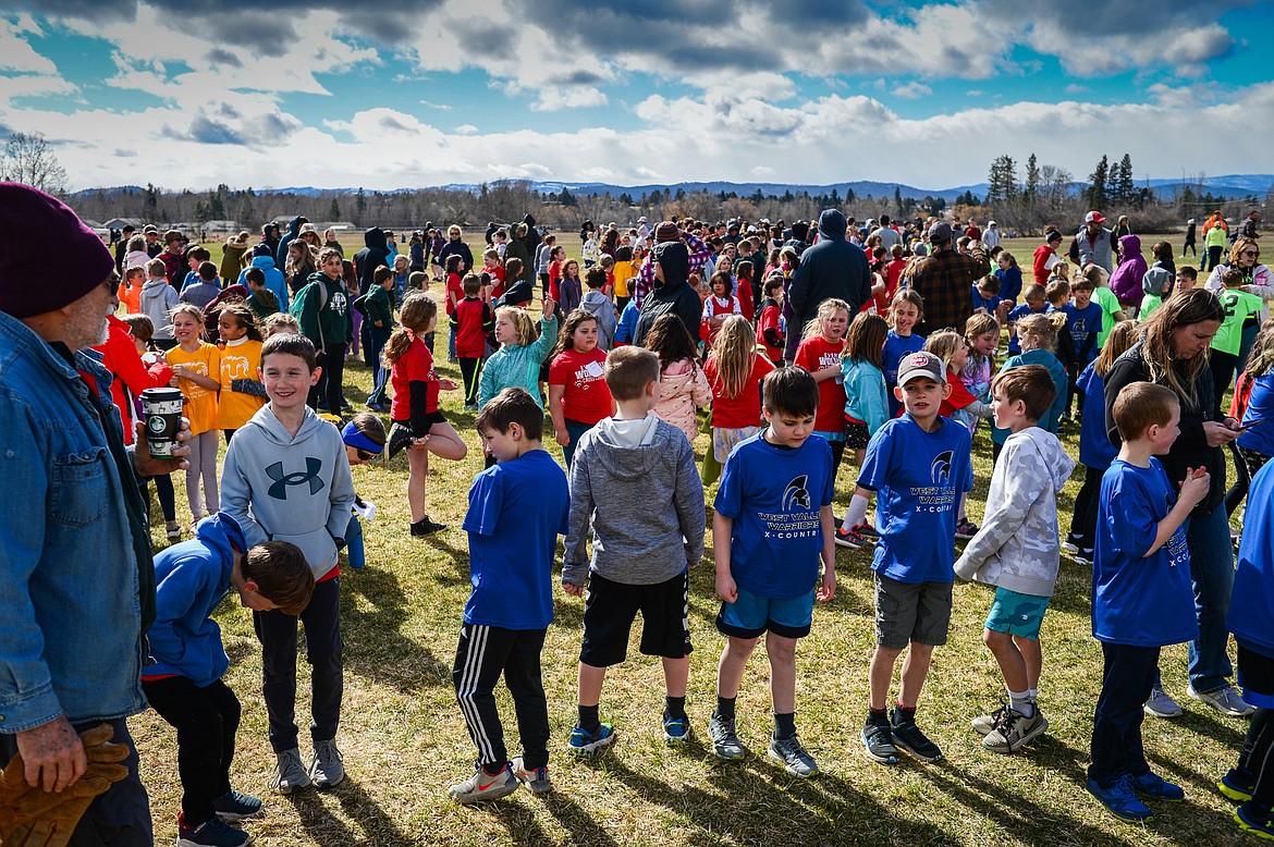 Students are staged in rows according to grade and gender before the races start at the Evergreen Schools' cross country meet on Tuesday, April 5. (Casey Kreider/Daily Inter Lake)
