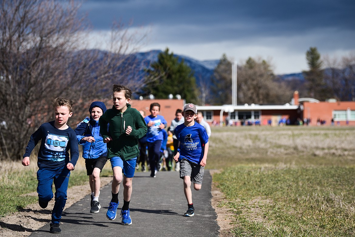 Kindergarten though fourth-grade students  run a half-mile loop while fifth- through eighth-graders run a mile-long course at the Evergreen Schools' cross country meet on Tuesday, April 5. (Casey Kreider/Daily Inter Lake)