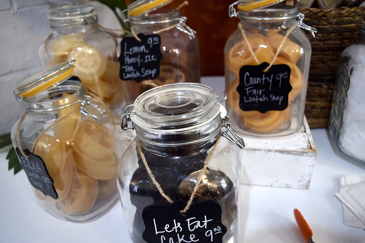 Jars containing some of the loofah-centered soaps Angela Clay makes and sells at her store Liberate & Lather.