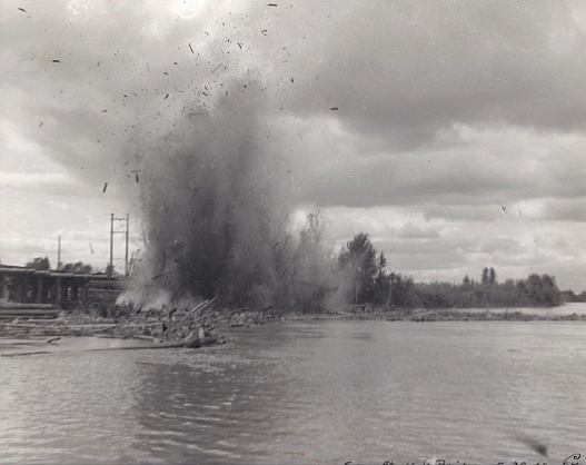 Log Truss Holt Bridge Across the Flathead River Being Blown Up (Kehoe Family Collection)