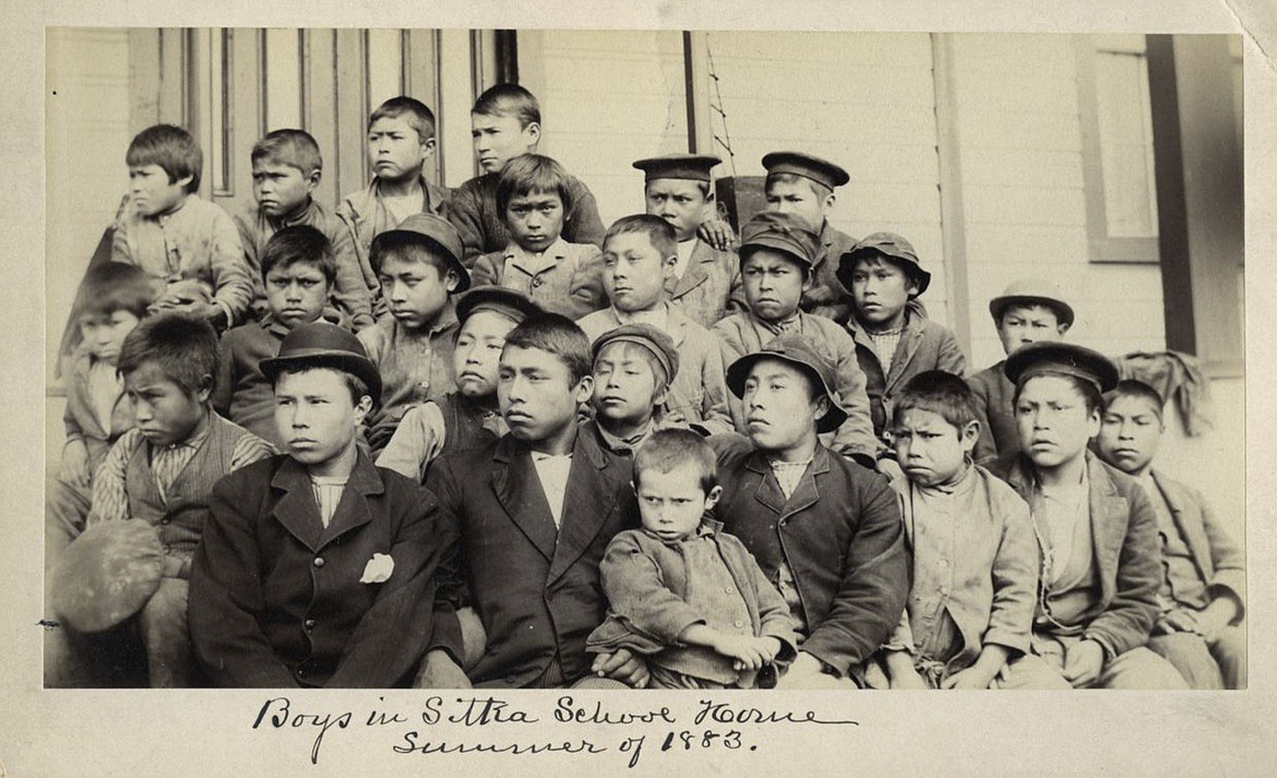 This photo made available by the Presbyterian Historical Society, Philadelphia shows students at a Presbyterian boarding school in Sitka, Alaska in the summer of 1883. U.S. Catholic and Protestant denominations operated more than 150 boarding schools between the 19th and 20th centuries. Native American and Alaskan Native children were regularly severed from their tribal families, customs, language and religion and brought to the schools in a push to assimilate and Christianize them. (Presbyterian Historical Society, Philadelphia via AP, File)