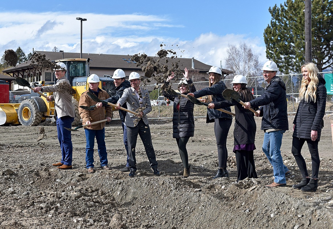 Stockman Bank employees on Monday hold an official ground-breaking ceremony at the site of the future Whitefish Stockman Bank on the corner of Highway 93 and 13th Street. (Whitney England/Whitefish Pilot)