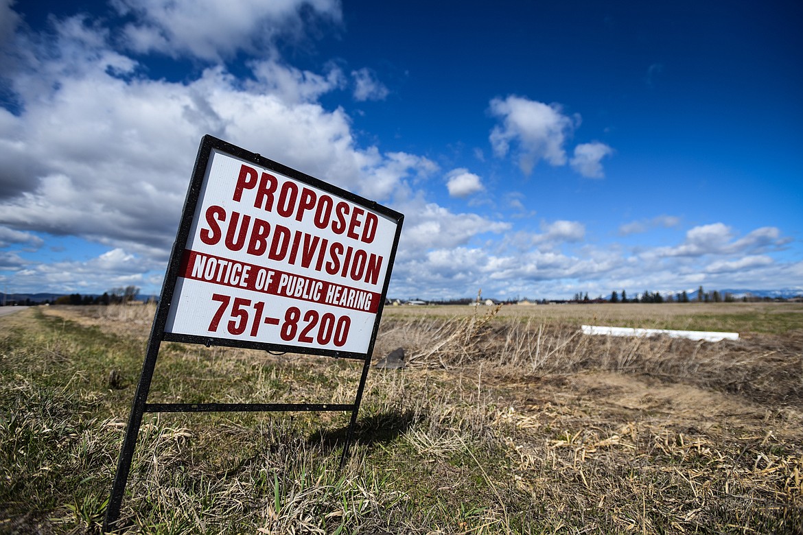 A sign for a notice of public hearing about a proposed subdivision along Holt Stage on Wednesday, April 6. (Casey Kreider/Daily Inter Lake)