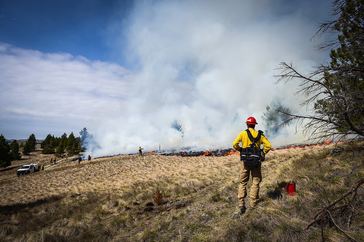 Fire crews from the Montana Department of Natural Resources & Conservation conduct a prescribed burn at Lone Pine State Park in Kalispell on Thursday, April 7. Held in conjunction with Montana Fish, Wildlife & Parks, the prescribed fire is aimed at benefiting the park's grassland habitat, including native plants and the wildlife species that frequent the area.(Casey Kreider/Daily Inter Lake)