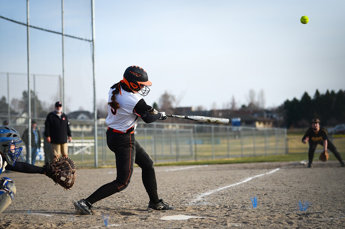 Flathead's Kaidyn Lake (5) connects on a 2-run home run in the first inning against Libby at Kidsports Complex on Thursday, April 7. (Casey Kreider/Daily Inter Lake)