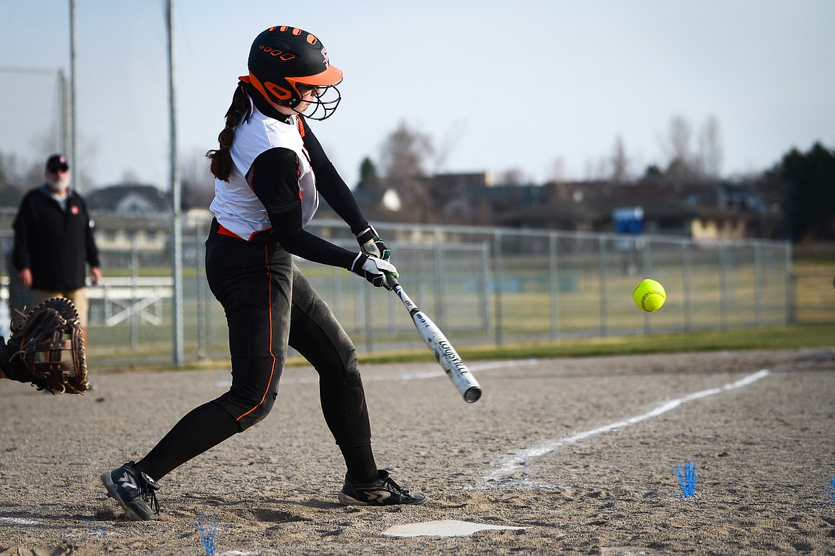 Flathead's Kaidyn Lake (5) connects on a 2-run home run in the first inning against Libby at Kidsports Complex on Thursday, April 7. (Casey Kreider/Daily Inter Lake)