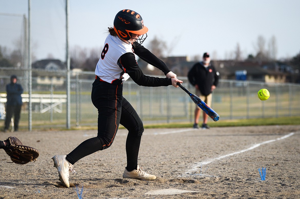 Flathead's Mackenzie Brandt (8) connects on an RBI double in the first inning against Libby at Kidsports Complex on Thursday, April 7. (Casey Kreider/Daily Inter Lake)