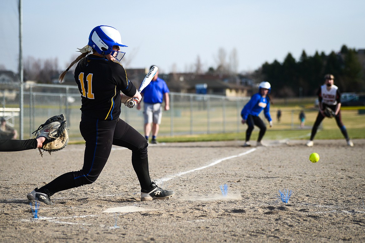 Libby's Mylie Rayome (11) connects on an RBI single against Flathead at Kidsports Complex on Thursday, April 7. (Casey Kreider/Daily Inter Lake)