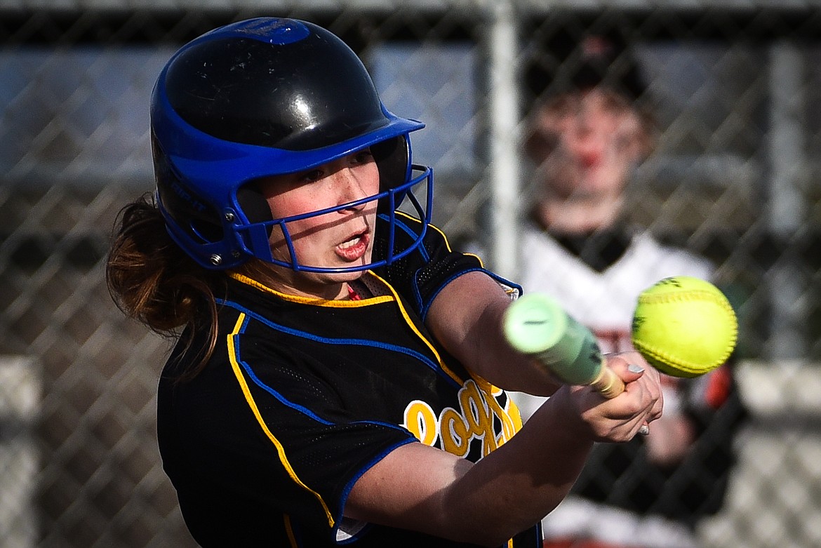 Libby's Jossalyn White (12) drives in a run on a fielder's choice against Flathead at Kidsports Complex on Thursday, April 7. (Casey Kreider/Daily Inter Lake)