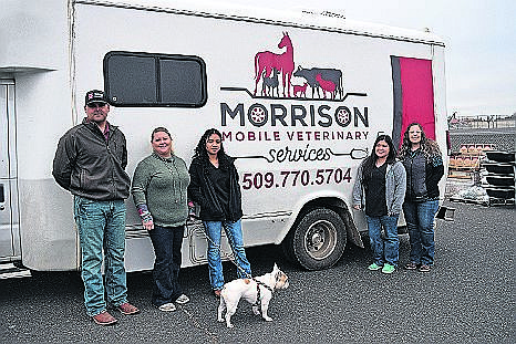 Chase Sidwell, Jessica Joslin, Jennifer Villanueva, Ashley Winn and veterinarian Jesyka Morrison pose outside Morrison’s new mobile veterinary practice in Moses Lake. While she makes house calls, Morrison has partnered with Basin Feed & Supply.