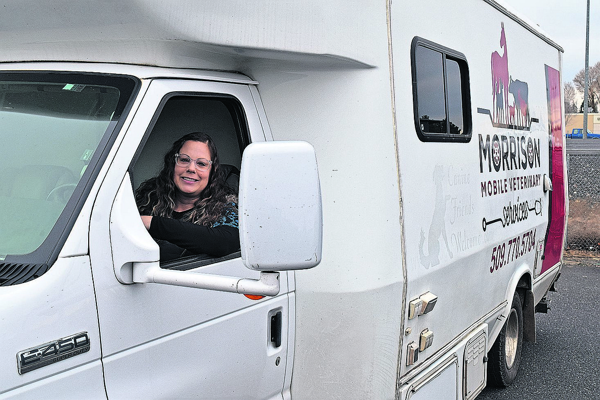 Veterinarian Jessica Morrison sits behind the wheel of her new van for her mobile veterinary practice, Morrison’s Mobile Veterinary Services, which is based at Basin Feed & Supply in Moses Lake.