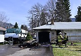 Garage, camper damaged in fire