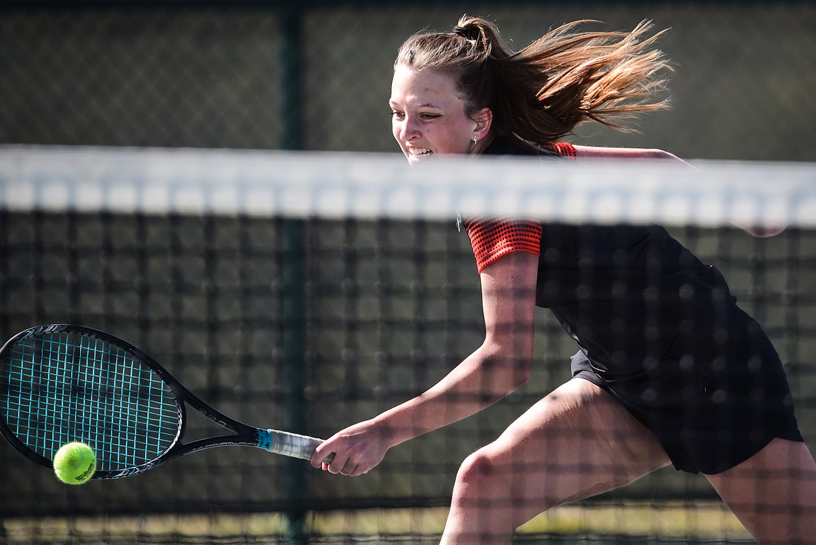 Flathead's Alexis Kersten hits a backhand return against Missoula Hellgate's Brooke Best at Flathead Valley Community College on Friday, April 8. (Casey Kreider/Daily Inter Lake)