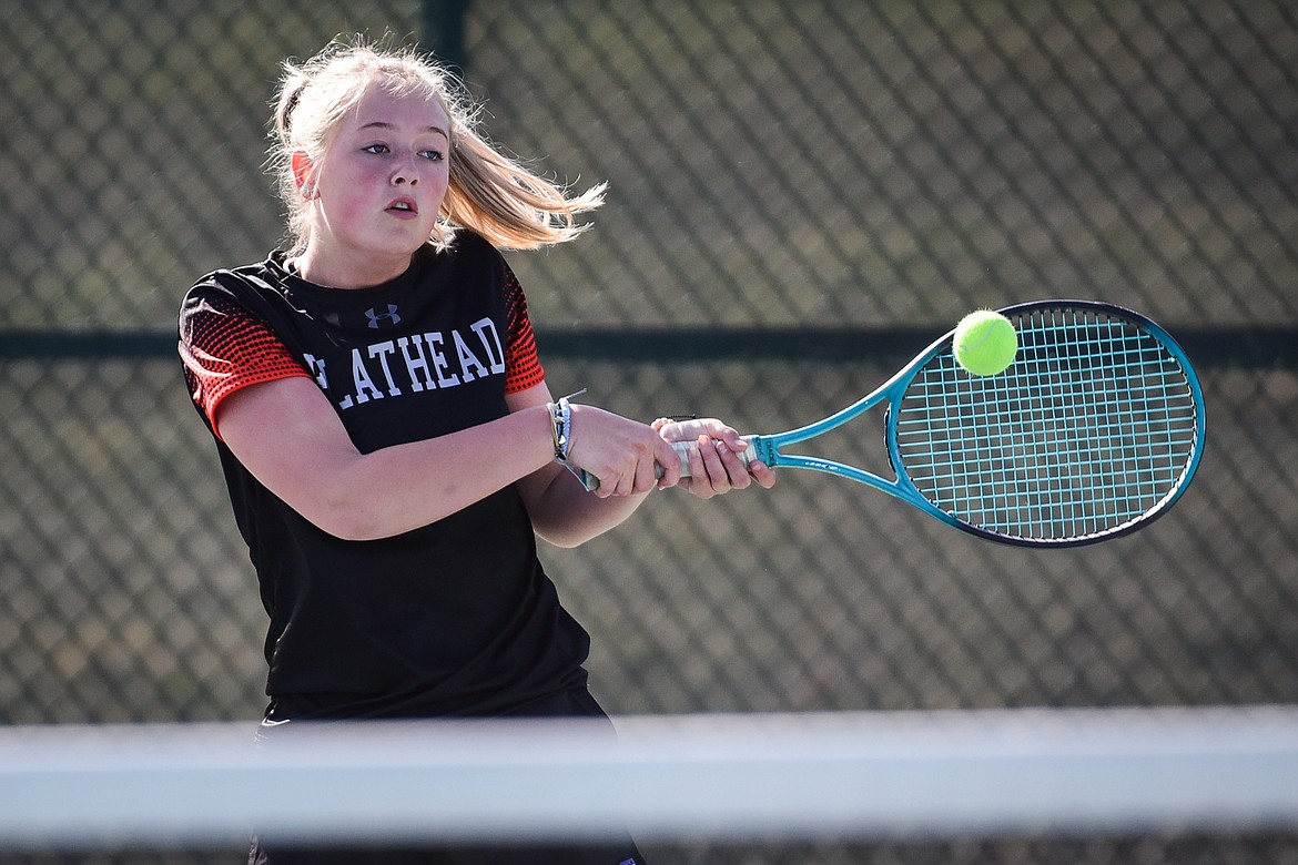 Flathead's Patricia Hinchey hits a backhand return against Missoula Hellgate's Chloe McCulloch at Flathead Valley Community College on Friday, April 8. (Casey Kreider/Daily Inter Lake)