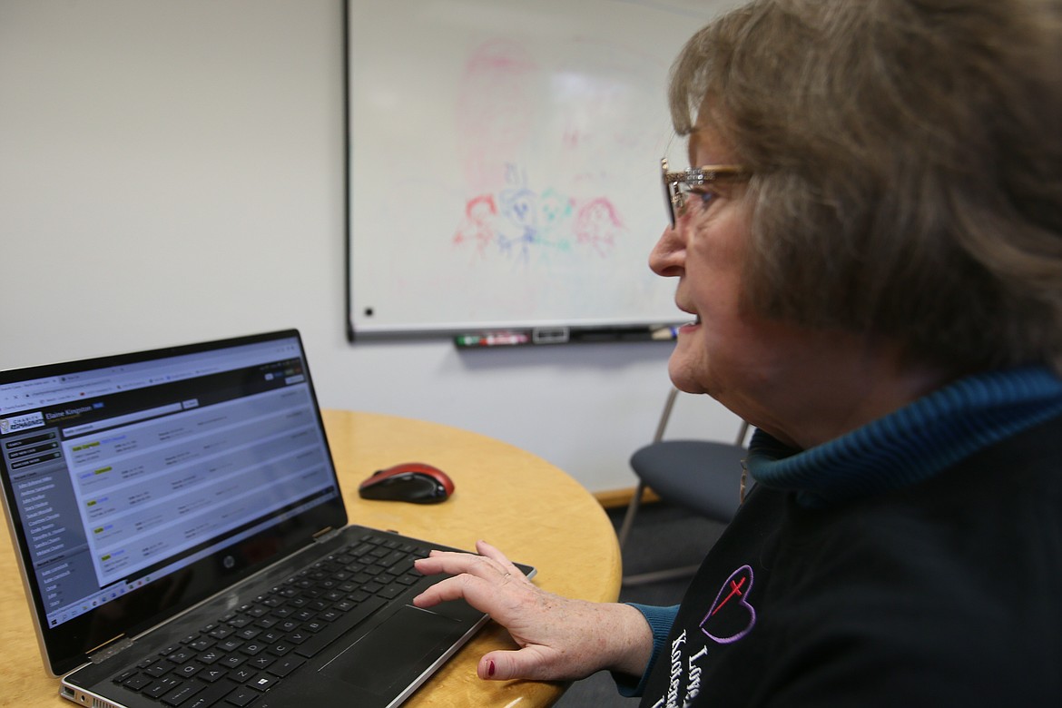 Pamela Mogen demonstrates how to use CharityTracker, a web app launched March 1 in Kootenai County. Charity Reimagined has paid licensing fees so CharityTracker is free for Inland Northwest organizations to use through 2022.