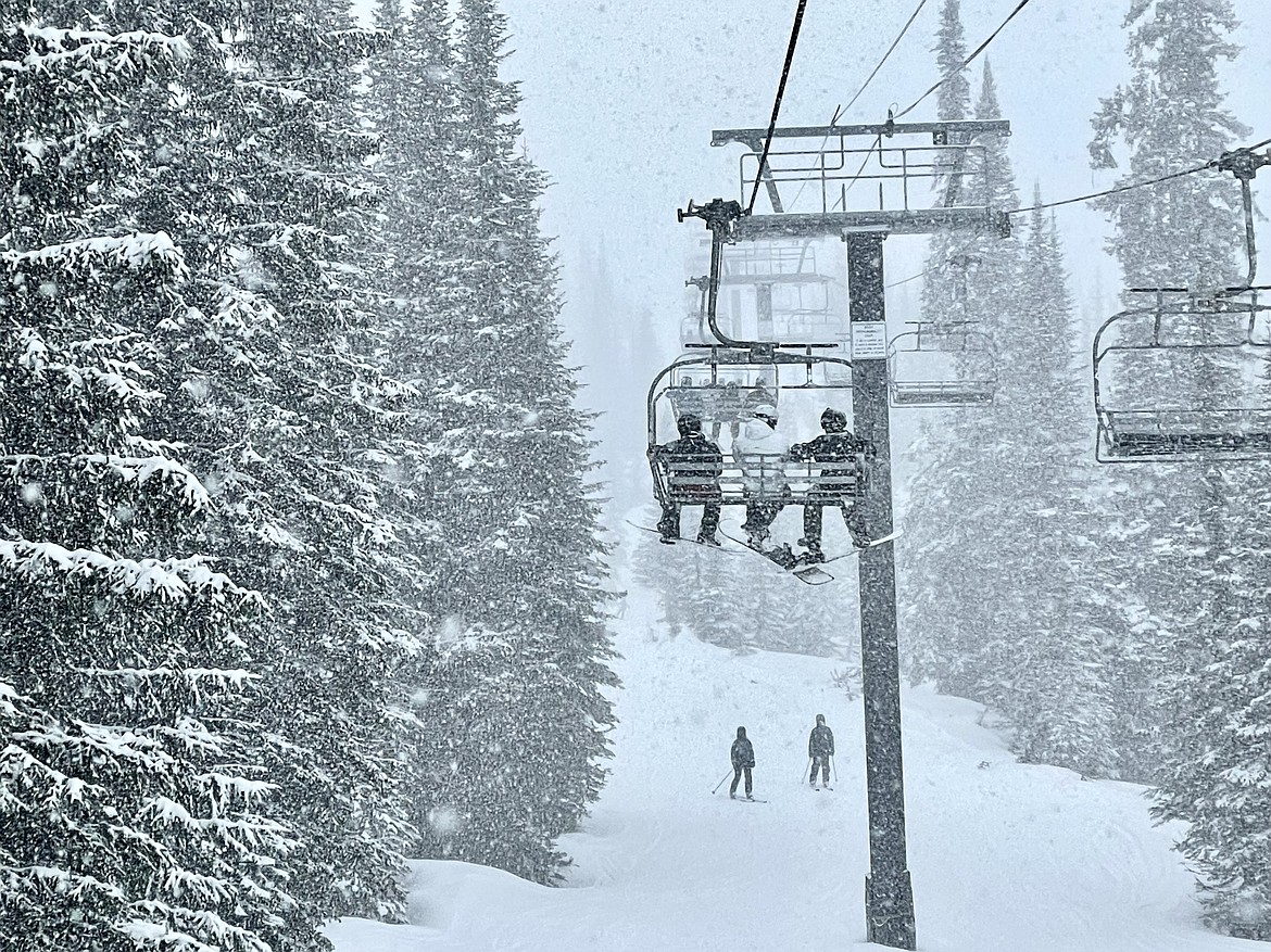 Skiers on Chair 7 at Whitefish Mountain Resort on the back side of Big Mountain. (Matt Baldwin/Daily Inter Lake)