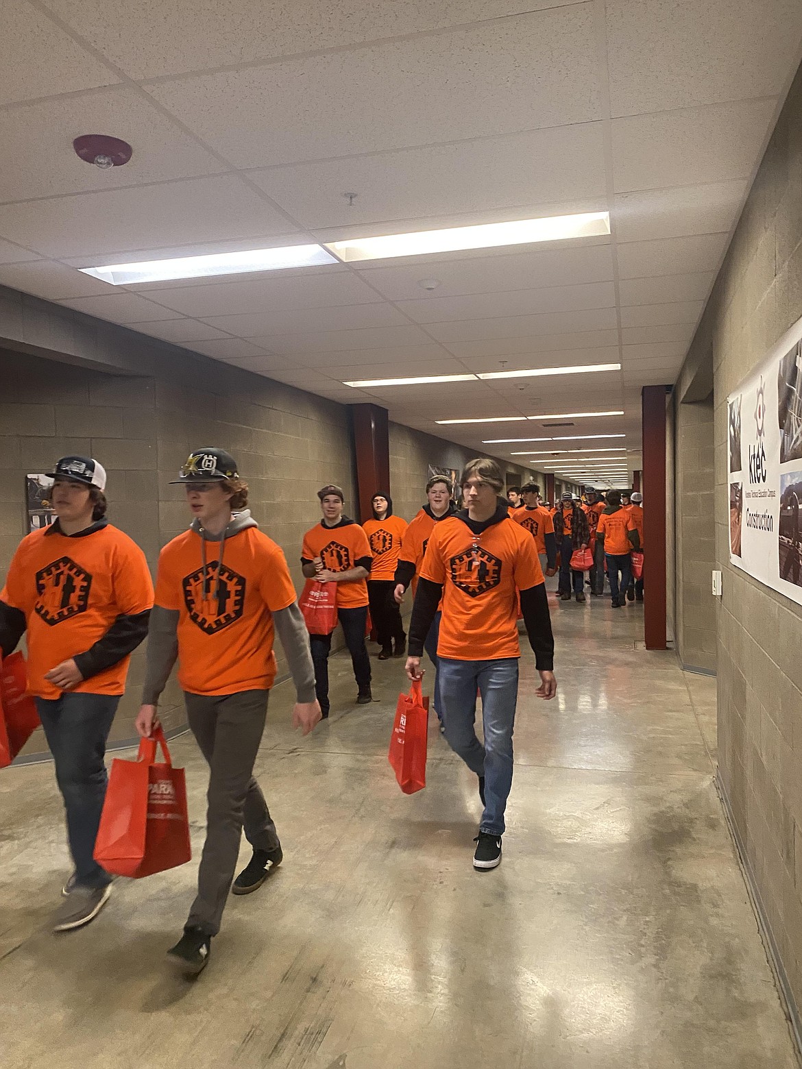 A sea of students in orange head through the halls of the Kootenai Technical Education Center Friday at the annual Hard Hats, Hammers and Hot Dogs event. Three groups of students from 18 local schools came to connect with educational, trade and technical opportunities.