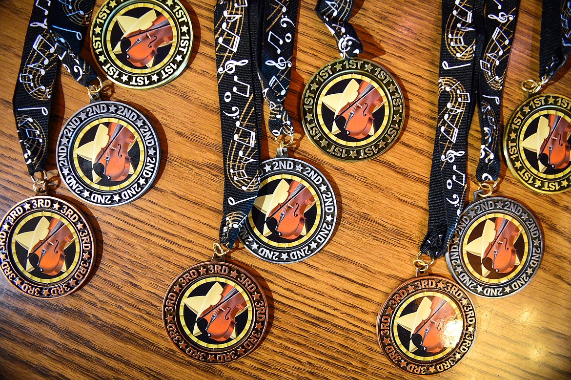 Trophies for youngest and oldest fiddler as well as medals for 1st, 2nd and 3rd place in junior, adult, no holds barred, theme song, champion, picking and accompanist at the 12th annual Glacier Fiddle Festival at Cornerstone Community Church in Kalispell on Saturday, April 9. (Casey Kreider/Daily Inter Lake)