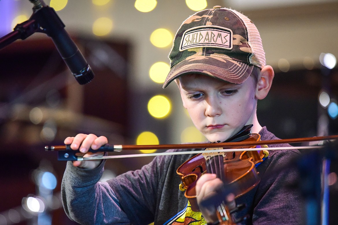Jared Penner performs "Cripple Creek" in the pee wee age division final round at the 12th annual Glacier Fiddle Festival at Cornerstone Community Church in Kalispell on Saturday, April 9. (Casey Kreider/Daily Inter Lake)