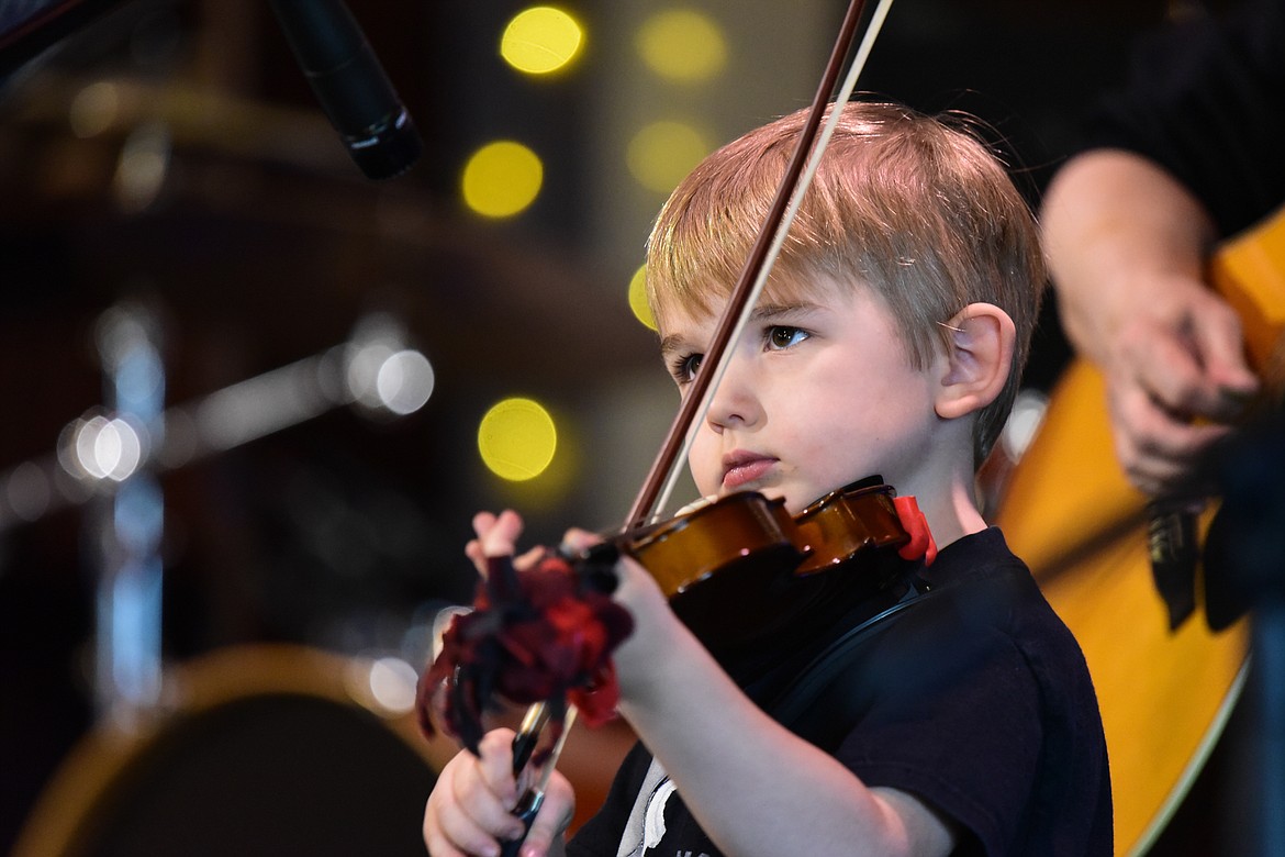 Clark Huguenin performs "Boil the Cabbage Down" in the pee wee age division final round at the 12th annual Glacier Fiddle Festival at Cornerstone Community Church in Kalispell on Saturday, April 9. (Casey Kreider/Daily Inter Lake)