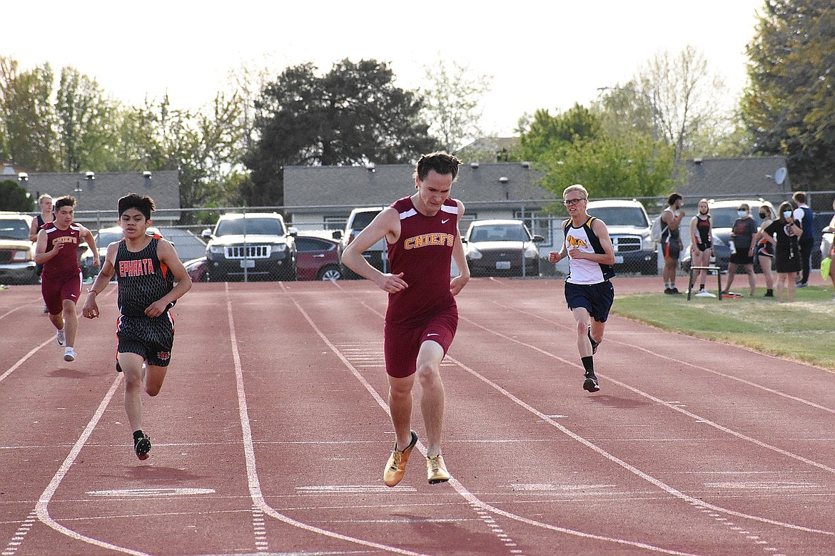 Moses Lake's Curtis Miller leads the pack with Ephrata's Edgar Rojas (left) in close pursuit at the North Central Washington Region track & field meet at Moses Lake High School on April 29, 2021.