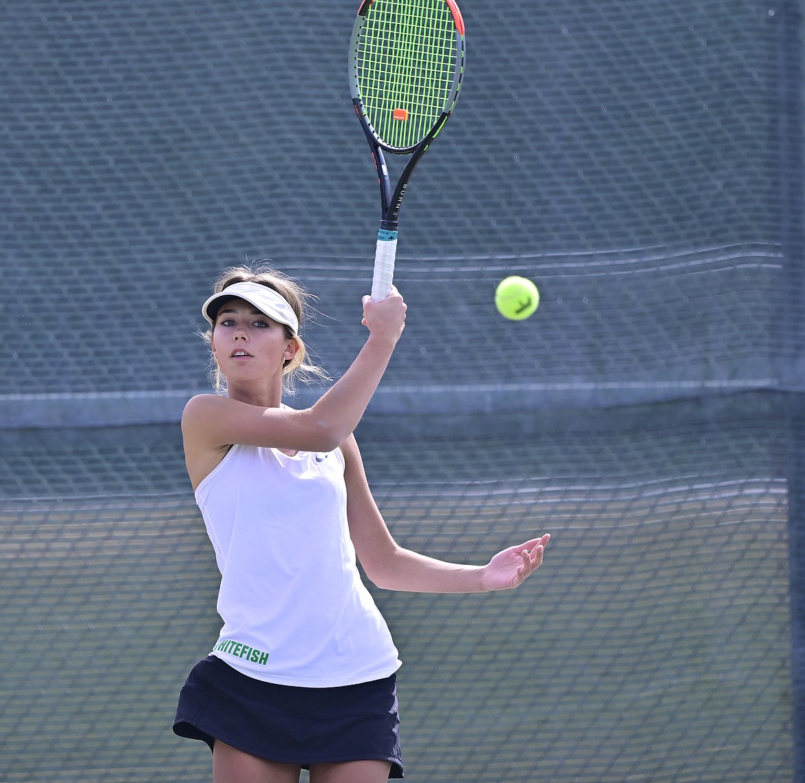 Lady Bulldog Lauren Brown hits a forehand shot during a match against Columbia Falls on Thursday. (Chris Peterson photo)