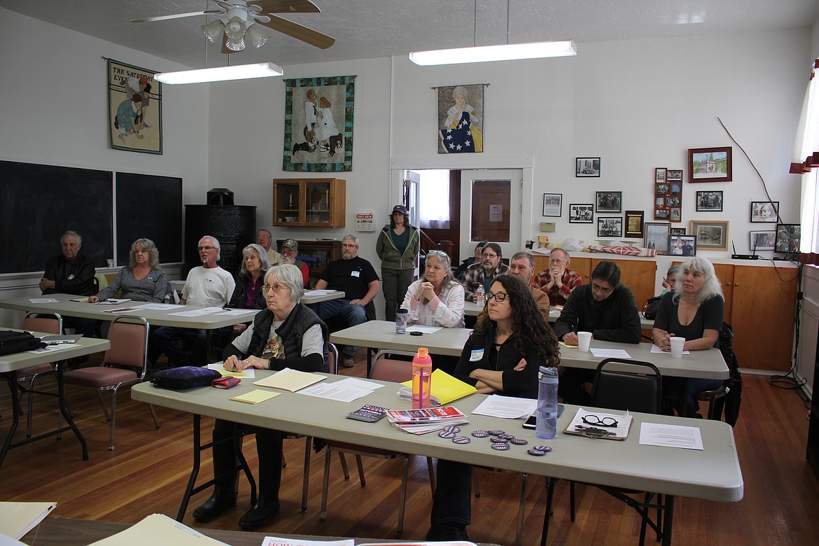 Residents at the Old DeBorgia School house attend the West End Neighborhood Watch meeting. (Monte Turner/Mineral Independent)