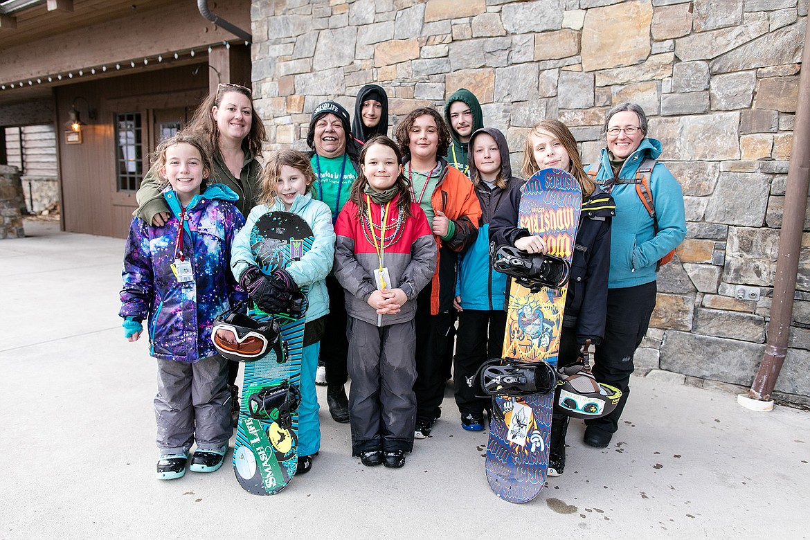 A group of the Plant a Seed Project kids outside of the Whitefish Mountain Resort Base Lodge earlier this season. (Jeff Hawe/Workhat Media)