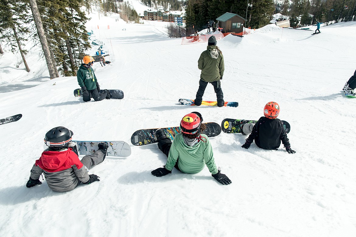 Young snowboarders with the Plant a Seed Project out on the hill for an evening of shredding at Whitefish Mountain Resort. (Jeff Hawe/Workhat Media)