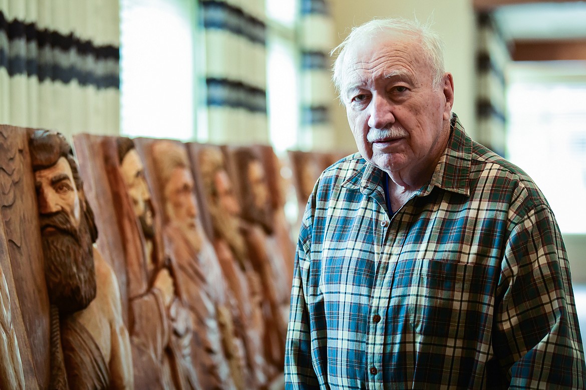 Master carver Frank Tetrault with his 12 Disciples carvings at Buffalo Hill Terrace in Kalispell on Tuesday, April 12. (Casey Kreider/Daily Inter Lake)
