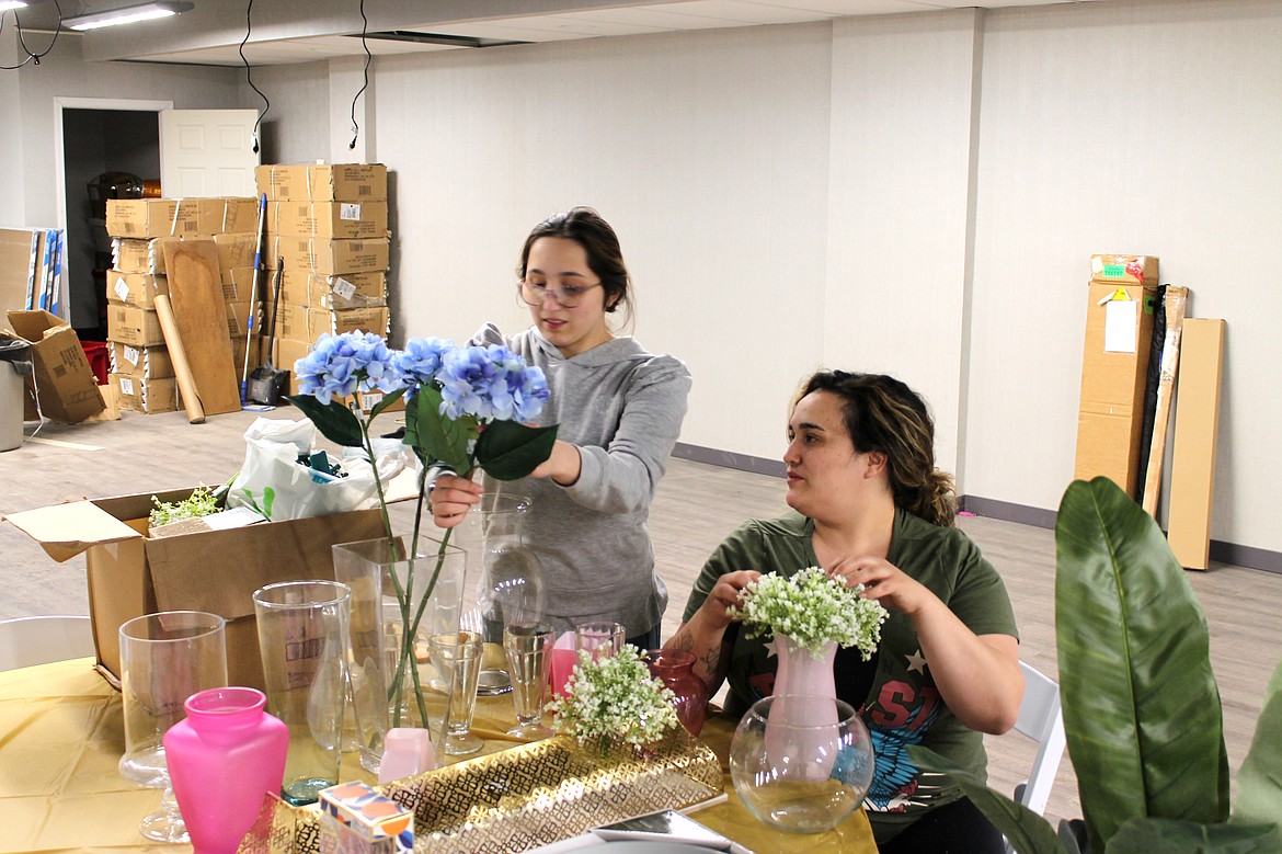 Christine Villareal-Ontiveros (right) and Nina Garza arrange flowers at Bell Event Studio on April 4. The facility was still in the process of being remodeled, to be ready in time for events April 8 and 9.