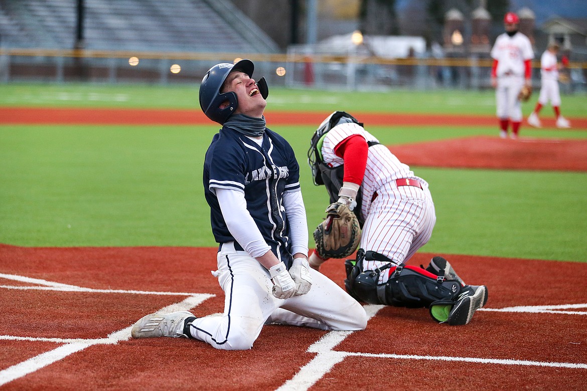 JASON DUCHOW PHOTOGRAPHY
Eric Bumbaugh of Lake City reacts after scoring on an inside-the-park homer in the second game of a baseball doubleheader with Sandpoint on Tuesday at War Memorial Field in Sandpoint.