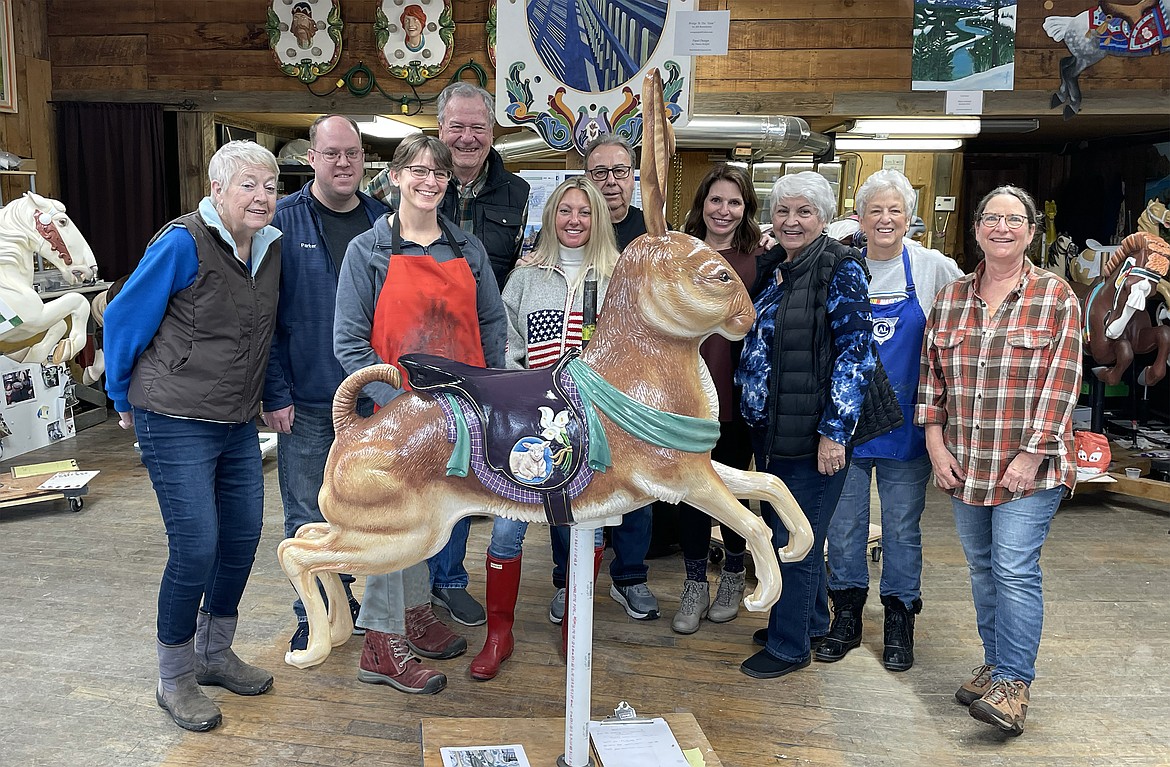 Members of the Sandpoint Carousel of Smiles painting team pose with Sir Hops-a-Lot after painting was completed and before he headed off to his permanent home with the GESA Carousel of Dreams in Kennewick, Washington.