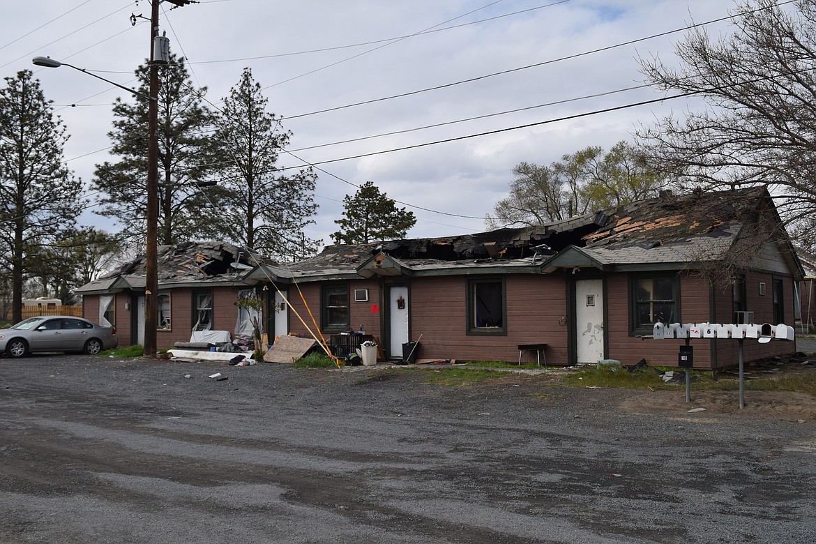 The remains of the fire-gutted, four-unit apartment building at the corner of North Grape Drive and West Luta Street. The fire left the residents of the building homeless, though first responders did put them in touch with local aid organizations.