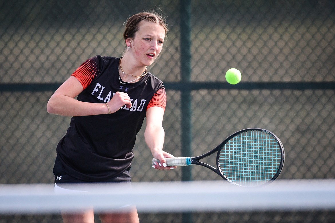 Flathead's Alexis Kerstein hits a return against Glacier's Naomi Jutzi at Flathead Valley Community College on Thursday, April 14. (Casey Kreider/Daily Inter Lake)