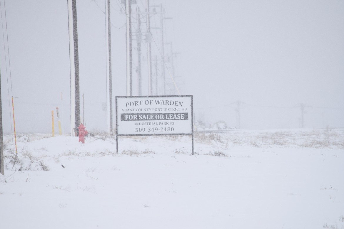 A sign advertising Port of Warden land for sale on Road U north of Warden. The port and the city of Warden are in talks with the Columbia Basin Railroad to sell land west of town the railroad would like to used to create a switching yard.