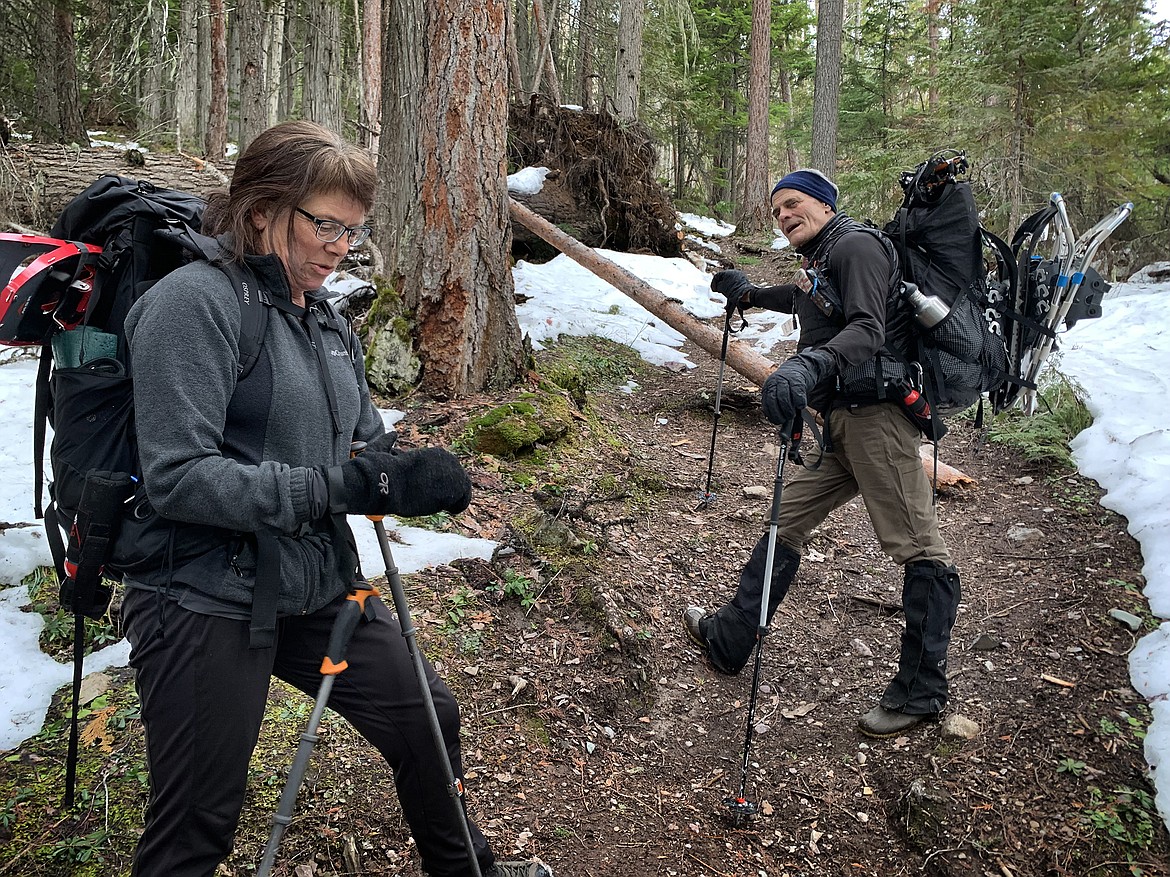 Glacier National Park biologist Lisa Bate and volunteer Gerard Byrd head out on Lincoln Lake Trail in search of owls. (Jeremy Weber/Daily Inter Lake)