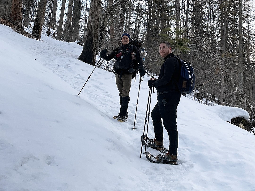 Gerard Byrd and Jeremy Weber take a break on their way up the Lincoln Lake Trail in search of owls in Glacier National Park. (Lisa Bate photo)