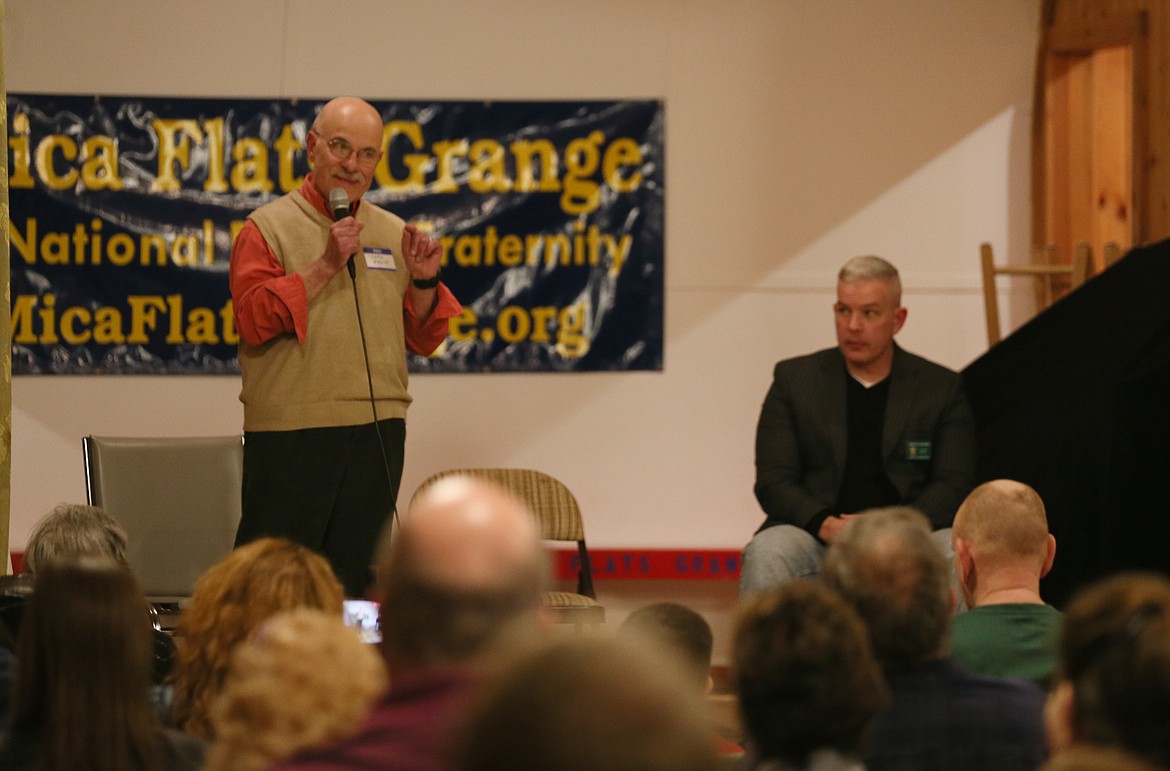 Incumbent Kootenai County Commissioner Chris Fillios speaks while opponent for District 2 seat Bruce Mattare waits his turn Friday during the candidate forum hosted by Mica Flats Grange.