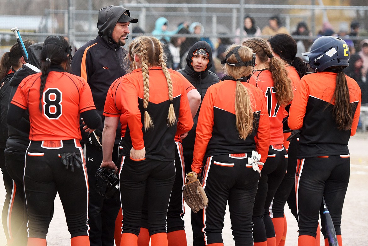 Ronan head coach Andy Luedtke huddles with this team between innings at Polson. (Scot Heisel/Lake County Leader)