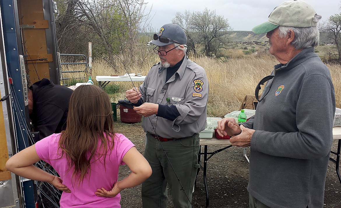 Magic Valley Region reservist Barry Myers helps with a Take Me Fishing trailer event.