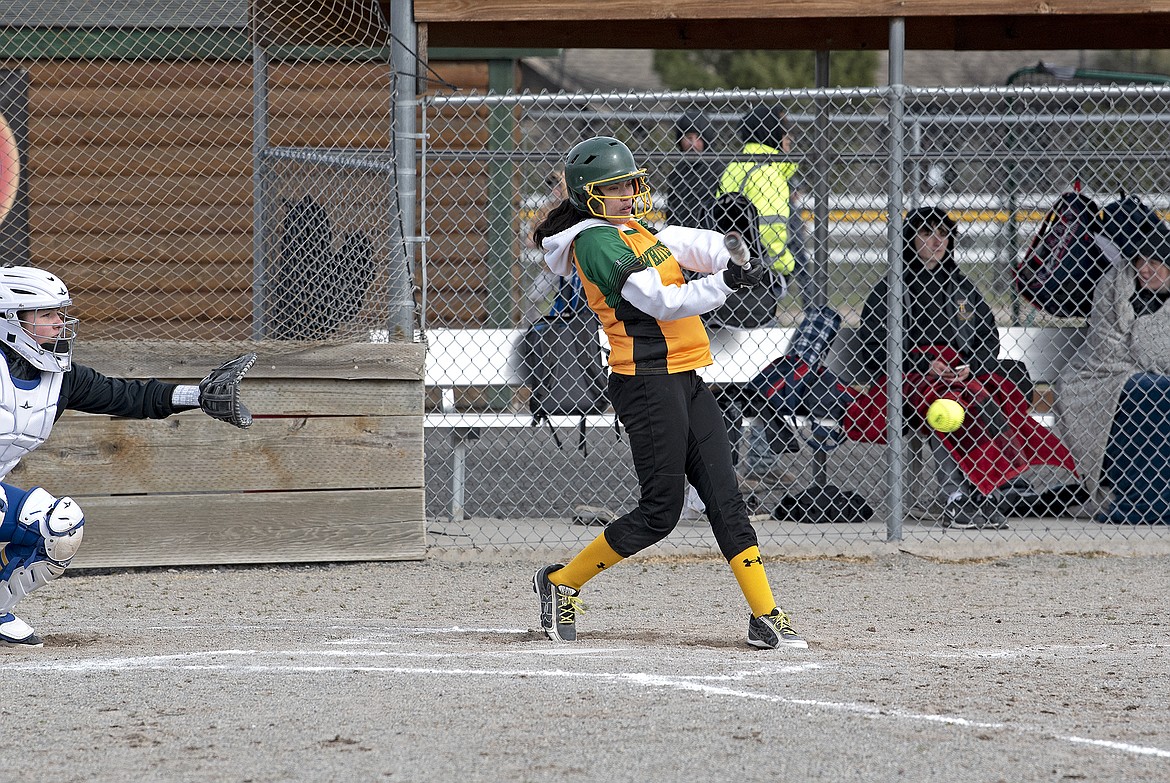 Bulldog Anyssa Castro hits a ground ball during a softball game against Thompson Falls on Tuesday, April 12 at Smith Fields. (Whitney England/Whitefish Pilot)