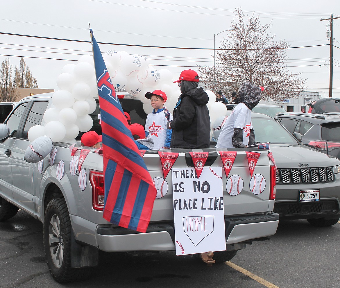 The MLYBA’s Angels wait in the pickup bed for the Dick Kelly Memorial Youth Day Parade to begin Saturday. The Angels won pizza from Domino’s for their spirit and pickup decorations.