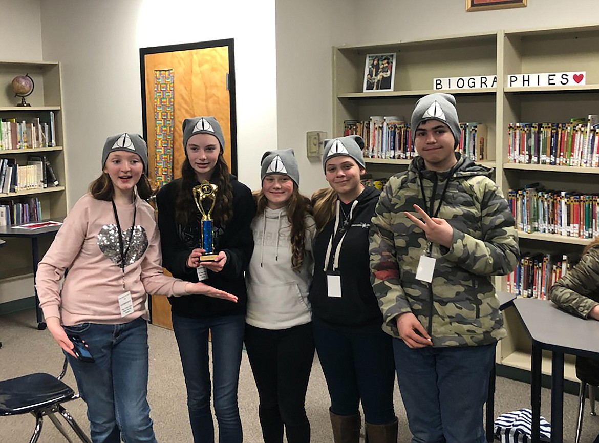 Members of “The Team That Must Not Be Named” — Amanda Miller, Hannah Ricks, Bria Rocke, Scarlett Straub, and Dakota Ferguson — pose for a photo after winning the regional Battle of the Books.