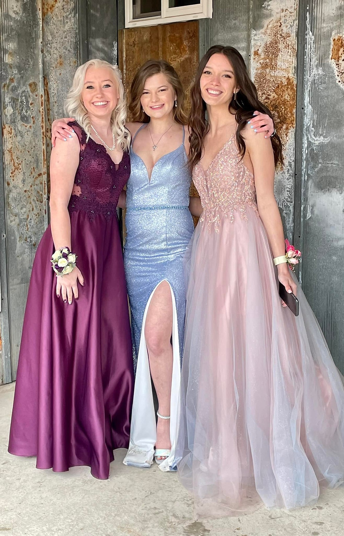 Friends since Kindergarten, Karmen Alexander, Taylor Hurd, and Rylie Burnham make memories attending their senior prom together at St. Regis High School. (Photo courtesy/Pamela Cole)