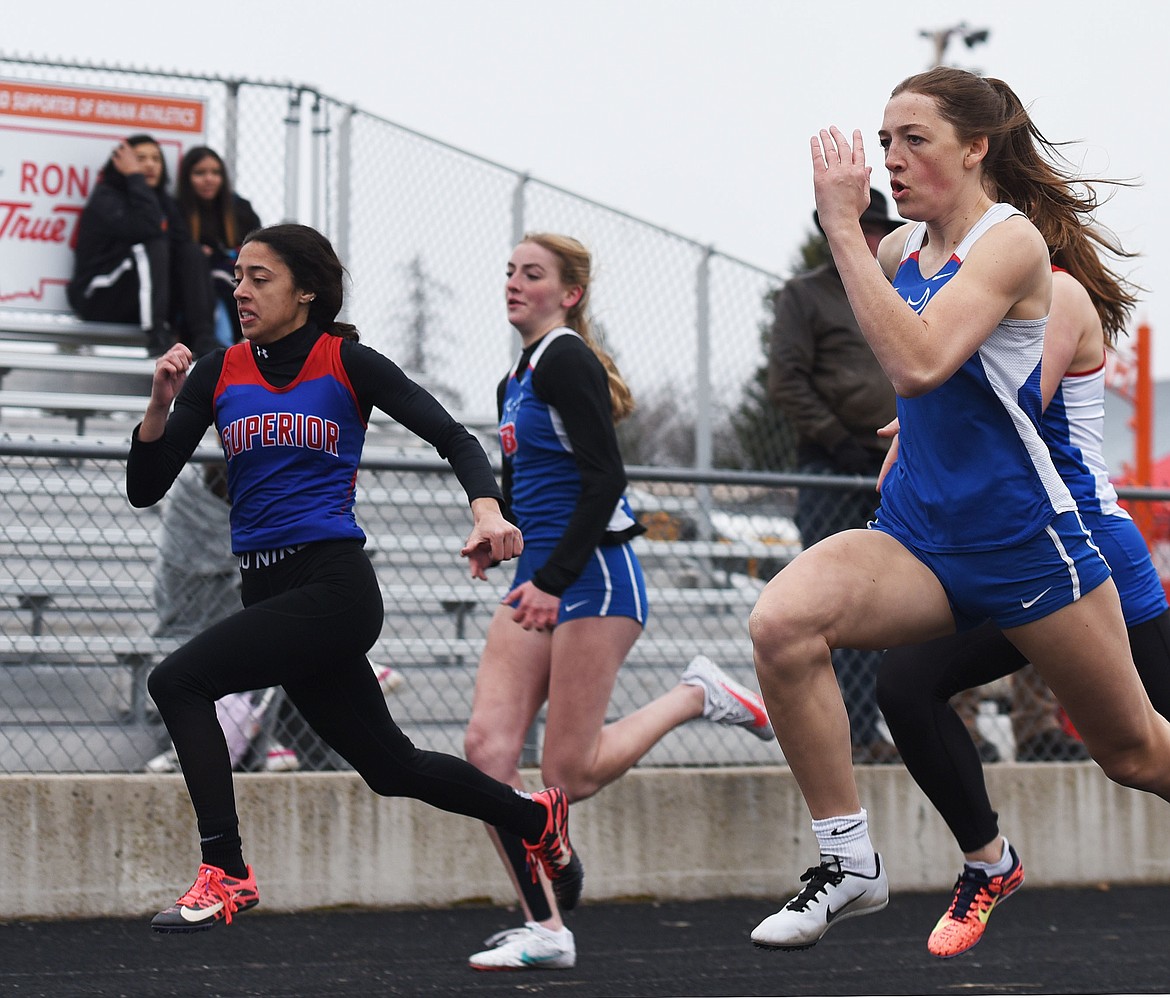 Superior junior Isabella Pereira (out front on the left) running a heat in the 100 meters dash at the Dilly Bar Invitational in Ronan. (Scot Heisel/Lake County Leader)
