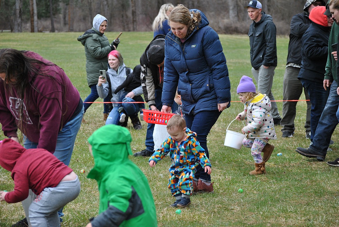 A flurry of little ones were released to hunt eggs right as a spring snow flurry started up in St. Regis on Saturday morning. With temperatures hovering right around 31 degrees, children gathered eggs quickly at the St. Regis Community Park. (Mineral Independent/Amy Quinlivan)