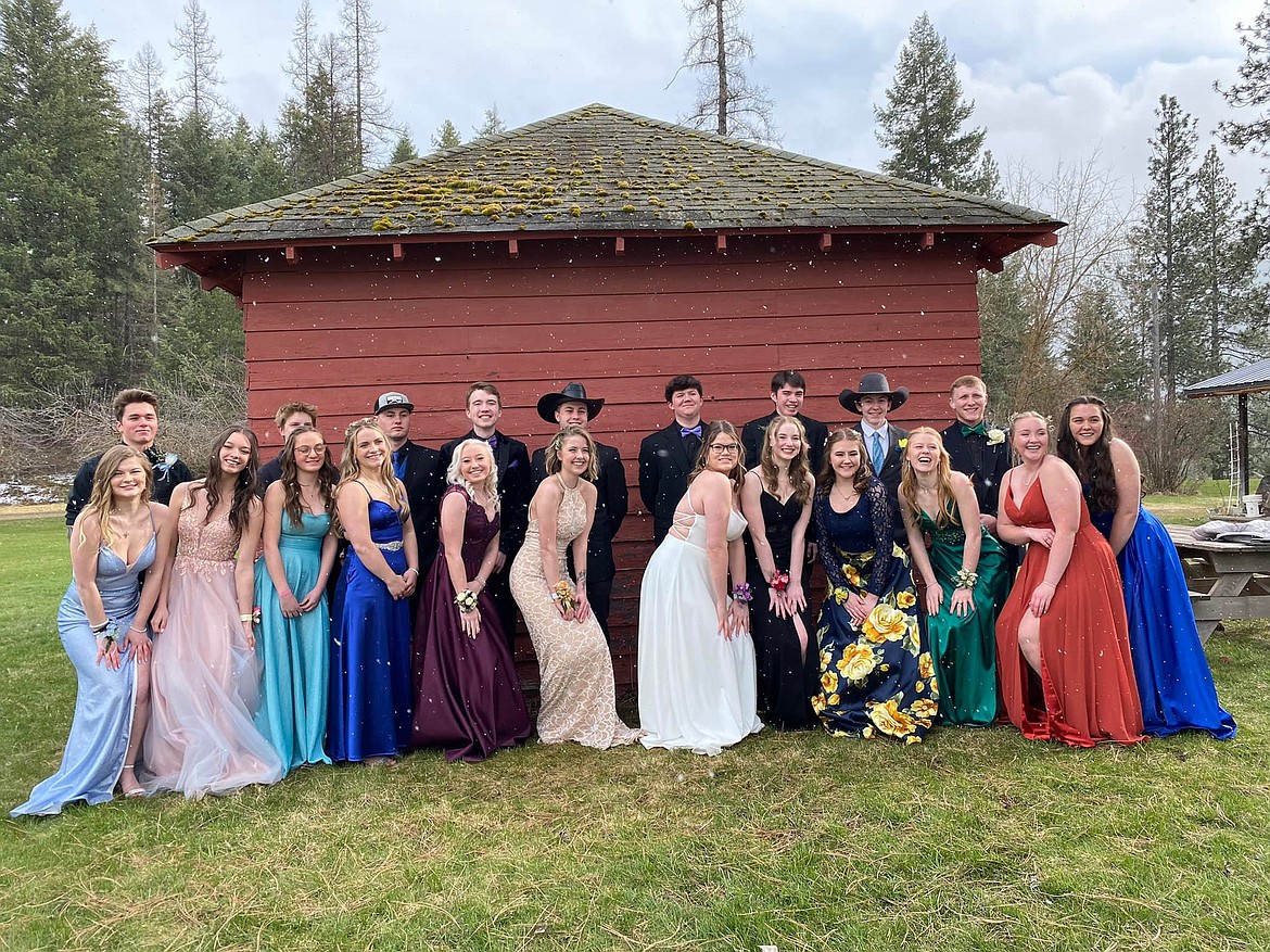 A group of St. Regis students and their dates strike a pose in the snow before heading off to prom on Friday night at the St. Regis Senior Center. (Photo courtesy/ Barb Jasper)