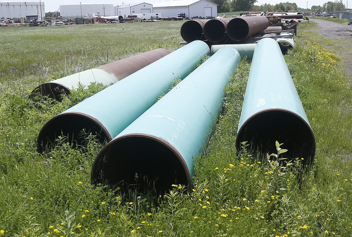 FILE - Pipeline used to carry crude oil is shown at the Superior, Wis., terminal of Enbridge Energy, June 29, 2018. The Biden administration is restoring federal regulations guiding environmental reviews of major infrastructure projects such as highways and pipelines that were scaled back by the Trump administration in a bid to fast-track the projects. A rule finalized Tuesday, April 19, 2022, will restore key provisions of the National Environmental Policy Act, a bedrock environmental law designed to ensure community safeguards during environmental reviews for a wide range of federal projects and decisions, the White House said. (AP Photo/Jim Mone, File)