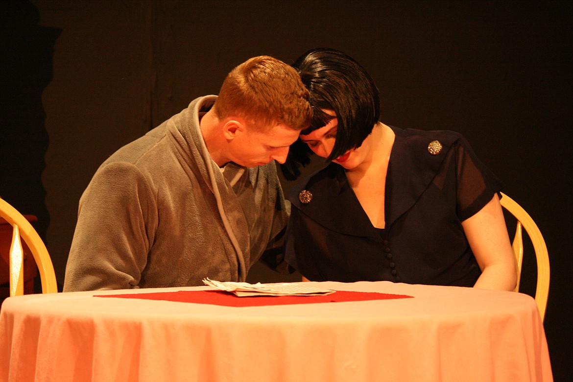 Tom Donohue (CW Forrest, left) comforts his wife Catherine (Mistya Zaleski, right) in a scene from “These Shining Lives.” The Masquers Theater production runs for three weekends, beginning April 22.